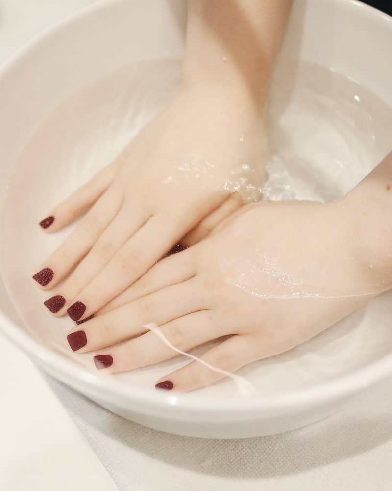 soaking hands in oils for cuticles