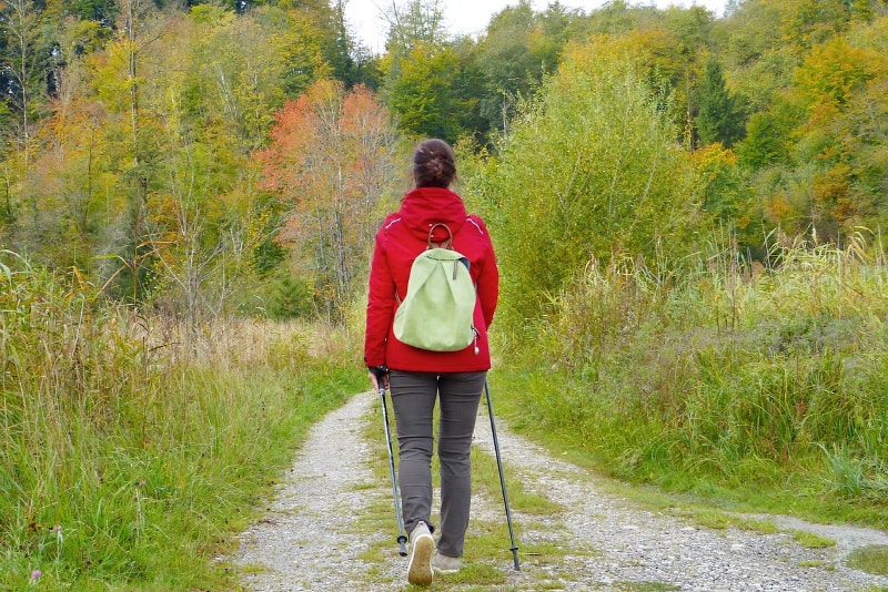 woman hiking wearing grey pants