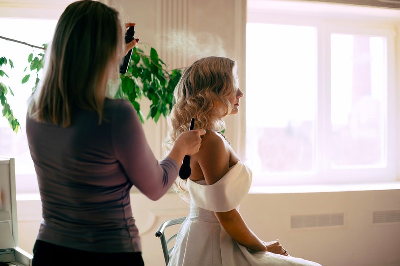 a woman having her hair done