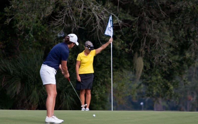 two women golfing