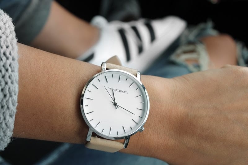 a woman wearing a wrist watch