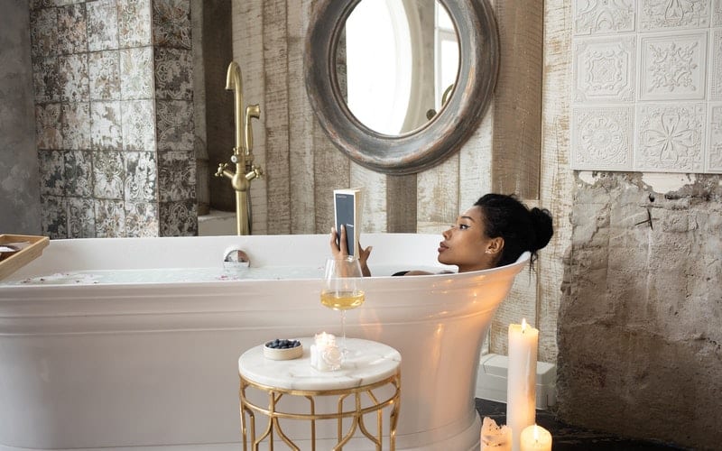 a woman relaxing in the tub for an at home spa day