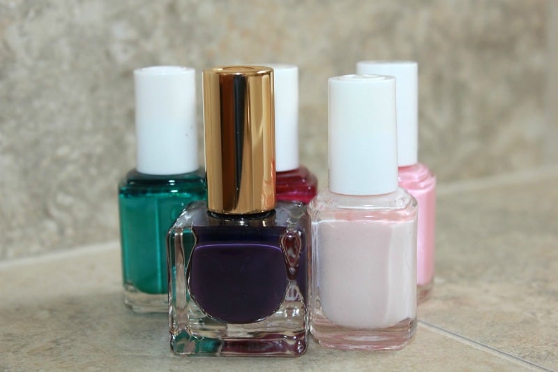 a row of nail polishes on a counter