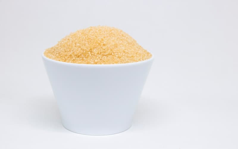 a white bowl with brown sugar