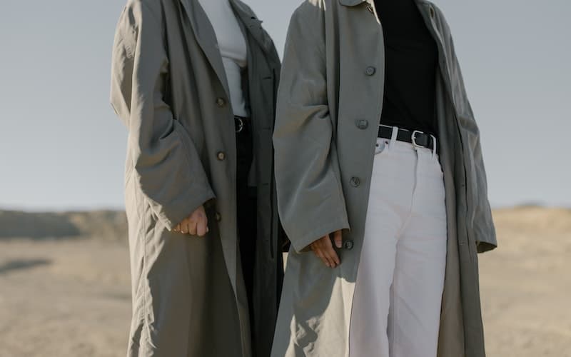 two people wearing stylish minimalist clothes