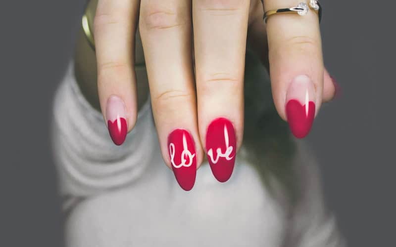 red nails with love written on them