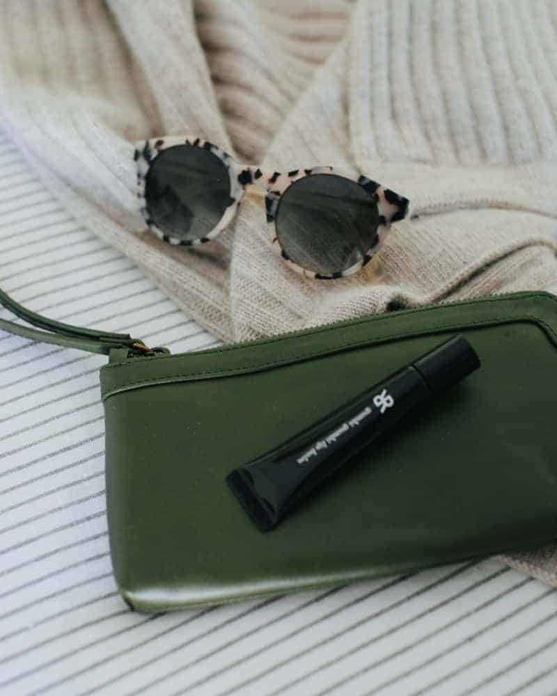 a cosmetic case and pair of sunglasses