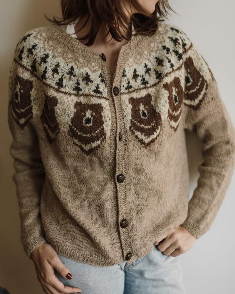 a woman wearing a buttoned up cardigan