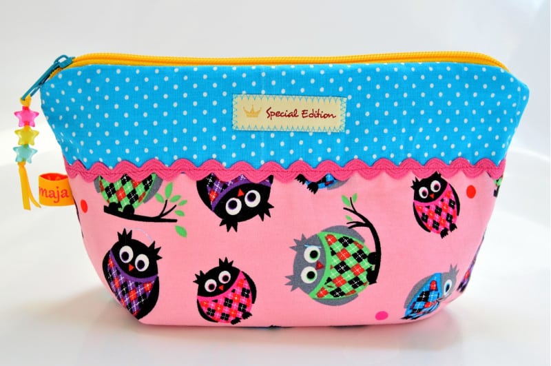 a brightly colored cosmetic bag