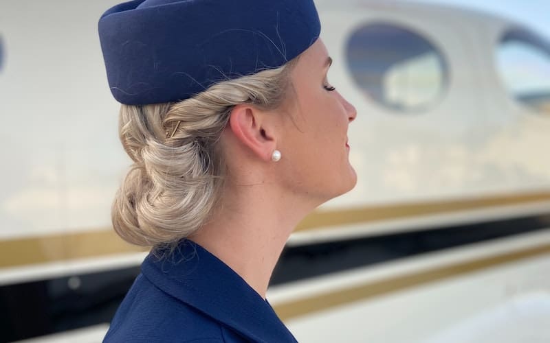 flight attendant wearing a blue hat