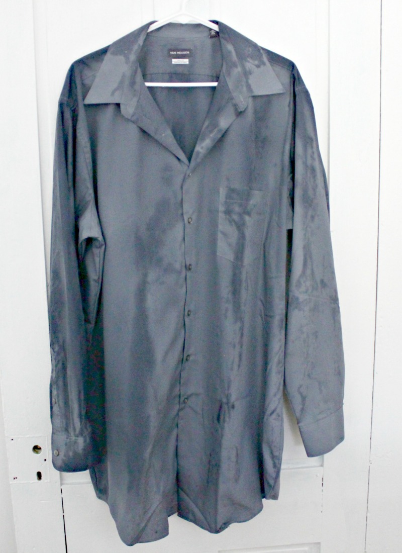 Damp grey shirt hanging up after being steamed