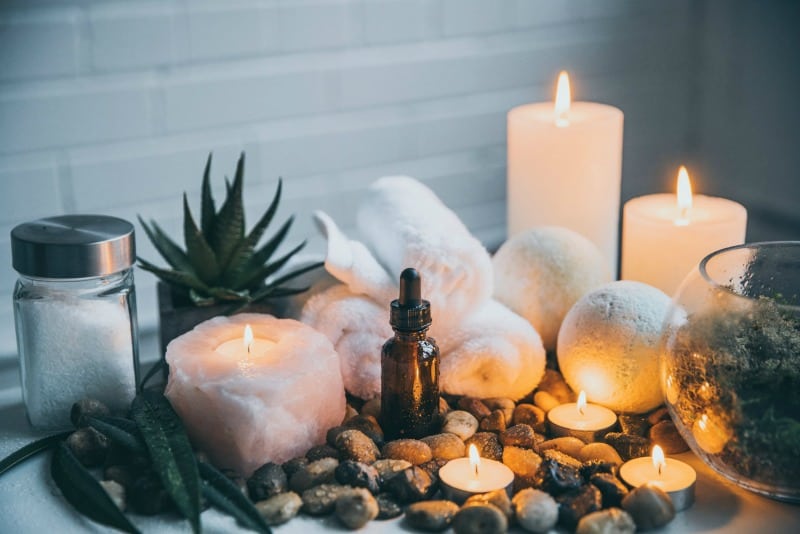 oils and candles with rocks in a spa setting