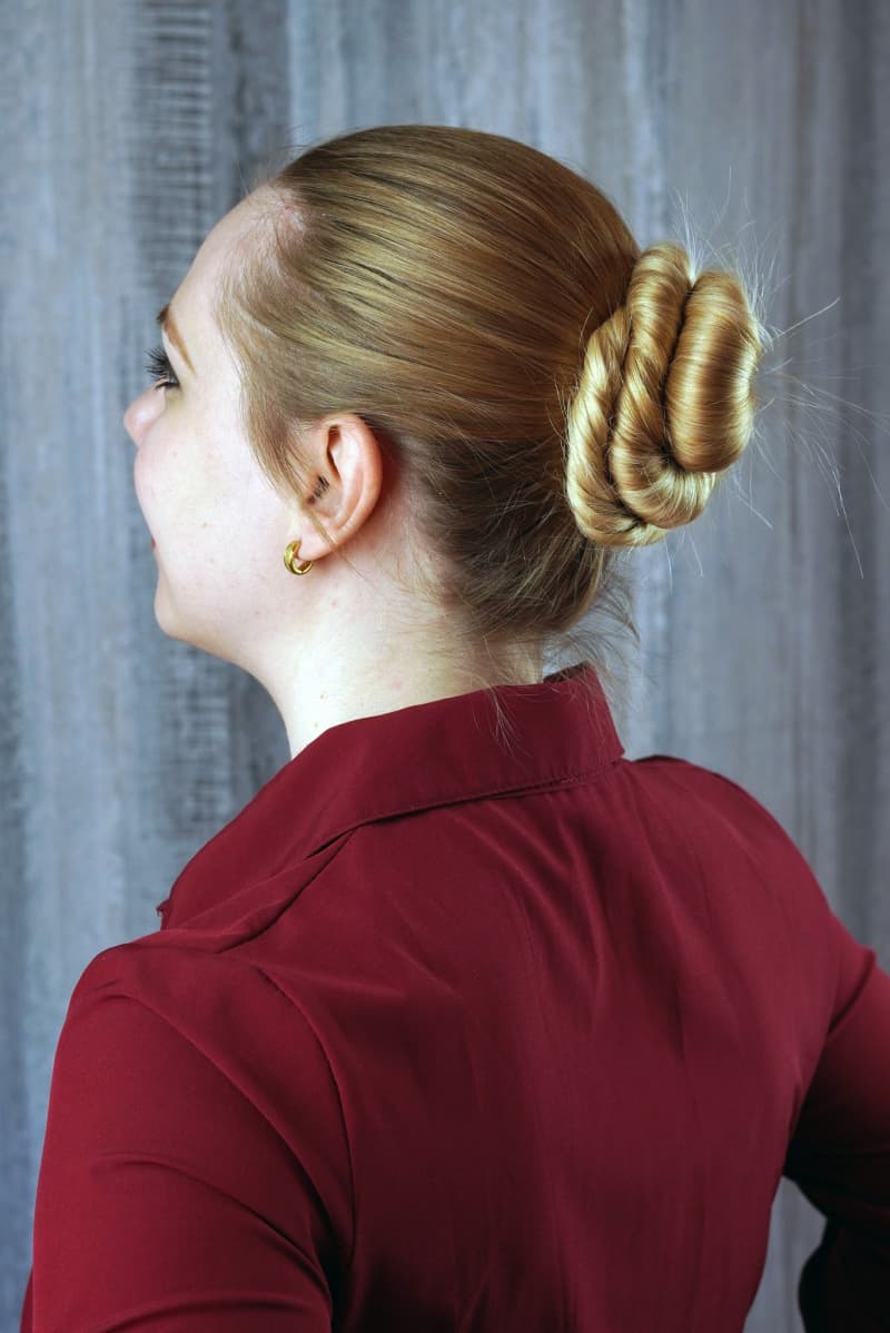 A woman with her hair in a bun