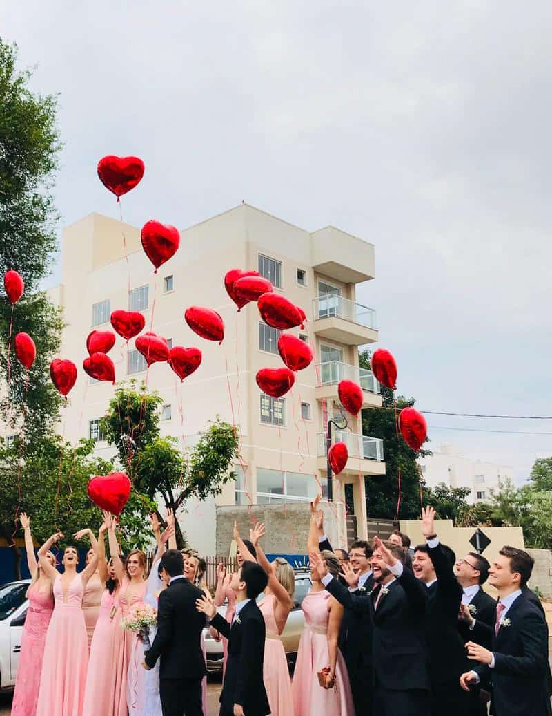 a wedding party releasing balloons