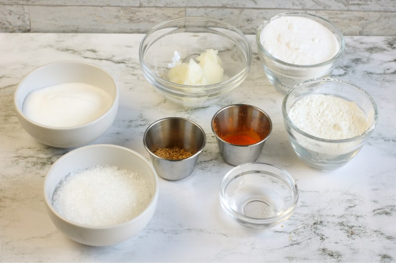 ingredients to make bath bombs on a white counter