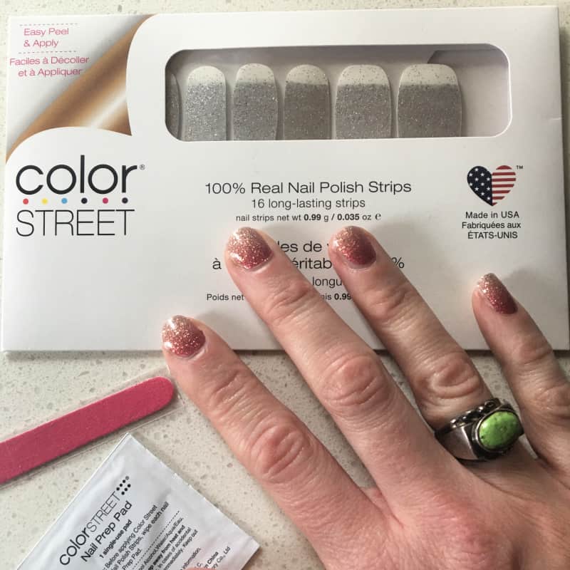 a package of nail strips and a woman wearing Coral Bay by Color Street