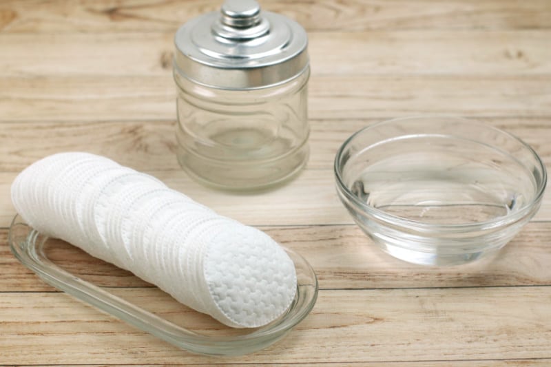 a glass jar, saline solution, and reusable cloth rounds