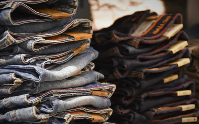 a pile of jeans folded