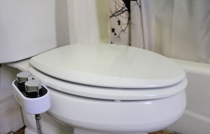 a toilet with a bidet installed