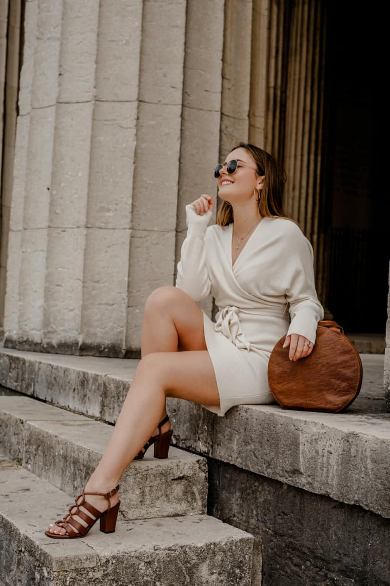 a stylish woman with a summer dress and brown sandals
