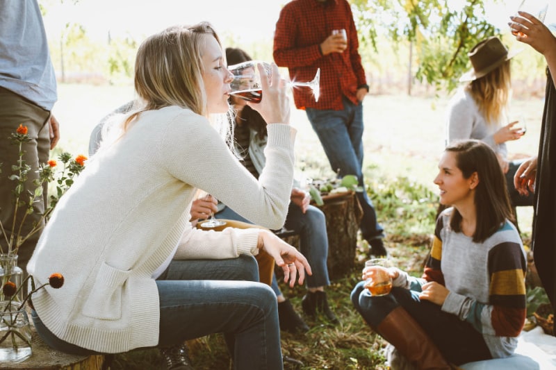 women sampling wine at an outdoor event