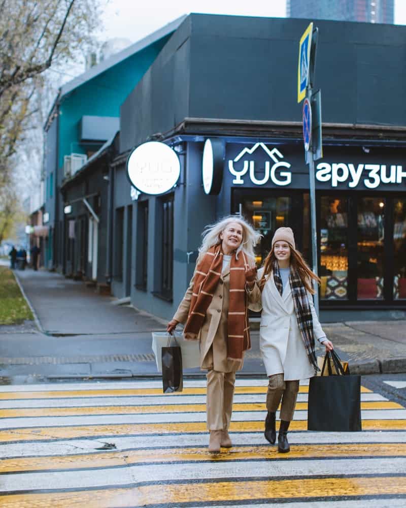 two women shopping for clothing in the winter