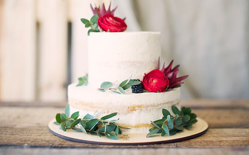 a wedding cake on a rustic table