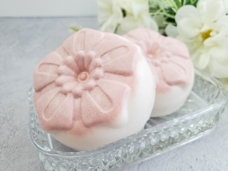 white and pink soap in a soap dish