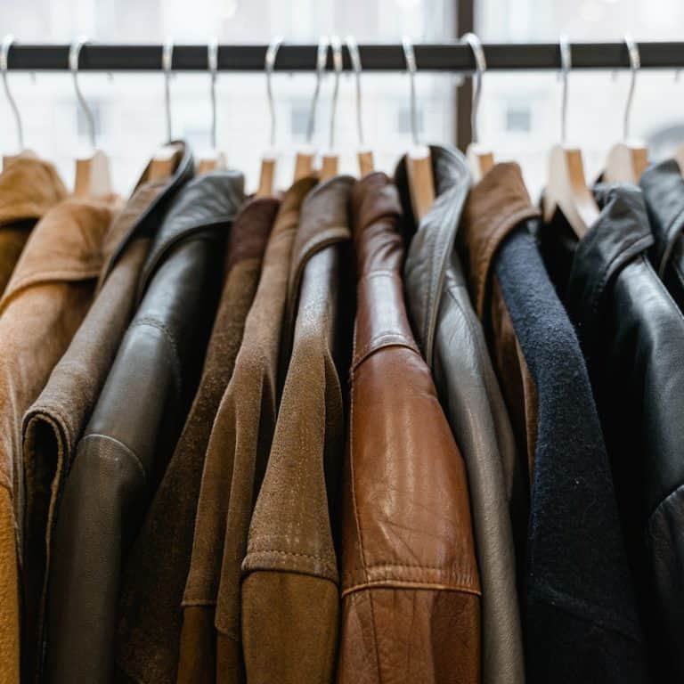 pleather jackets hanging on hangers