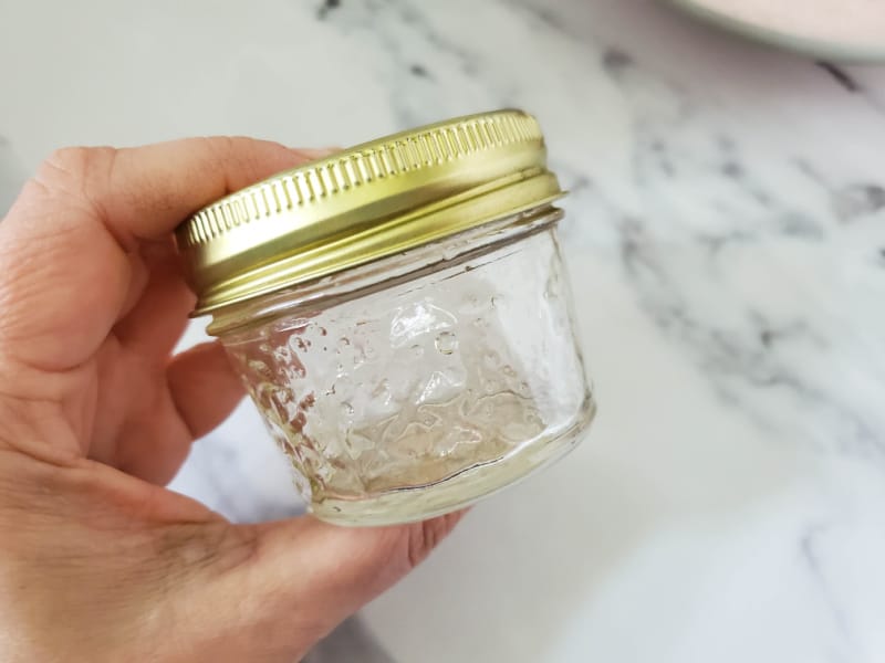 a small glass jar of oil