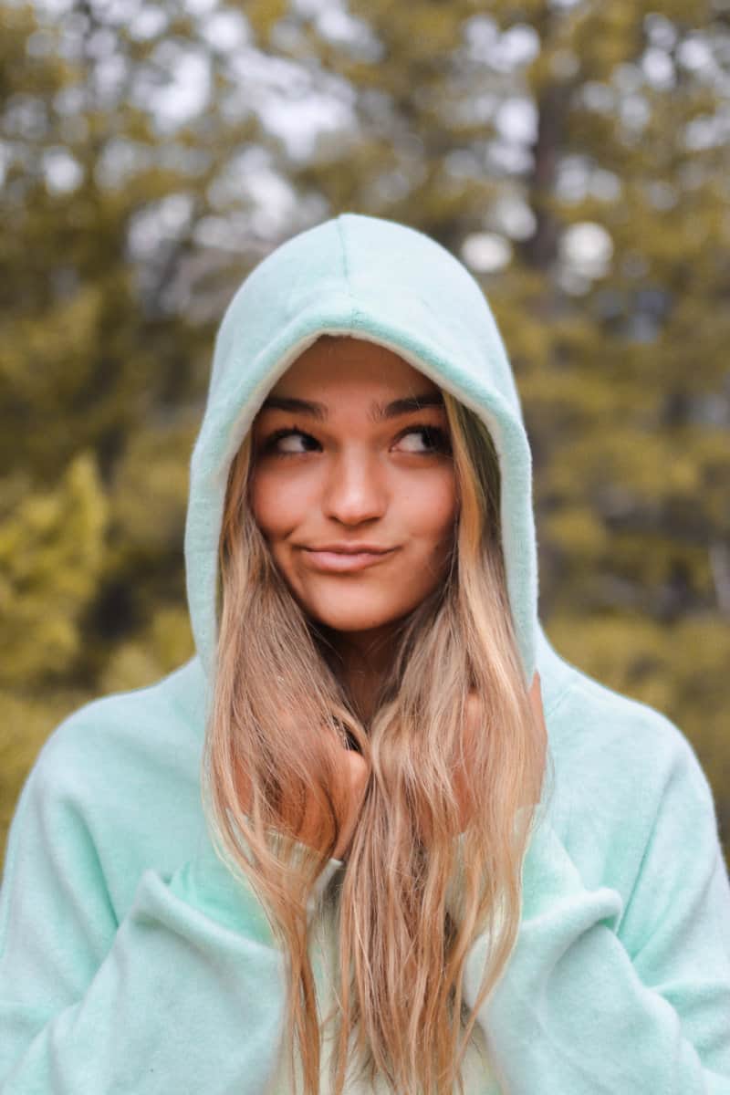woman wearing a green hoodie
