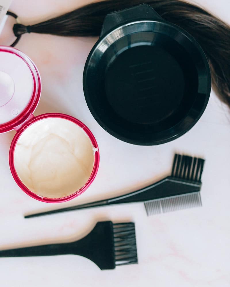 tools to dye hair including dye and brushes