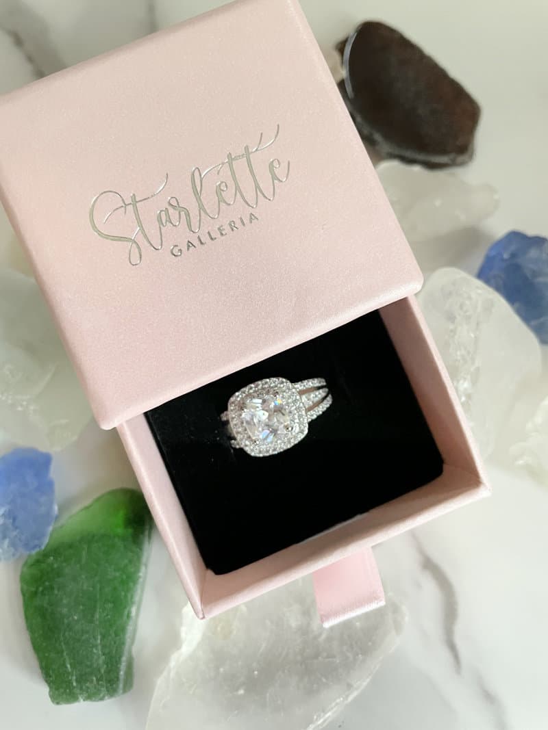 a box from Starlette Galleria with a cubic zirconia ring in it