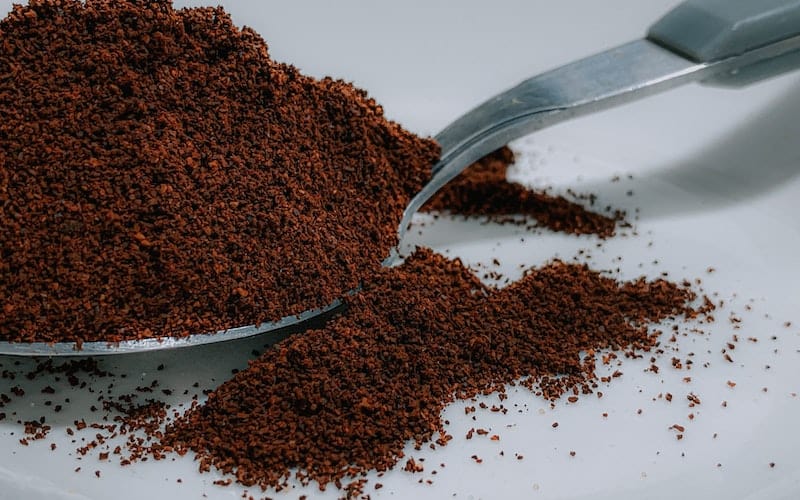 a spoon with coffee grounds