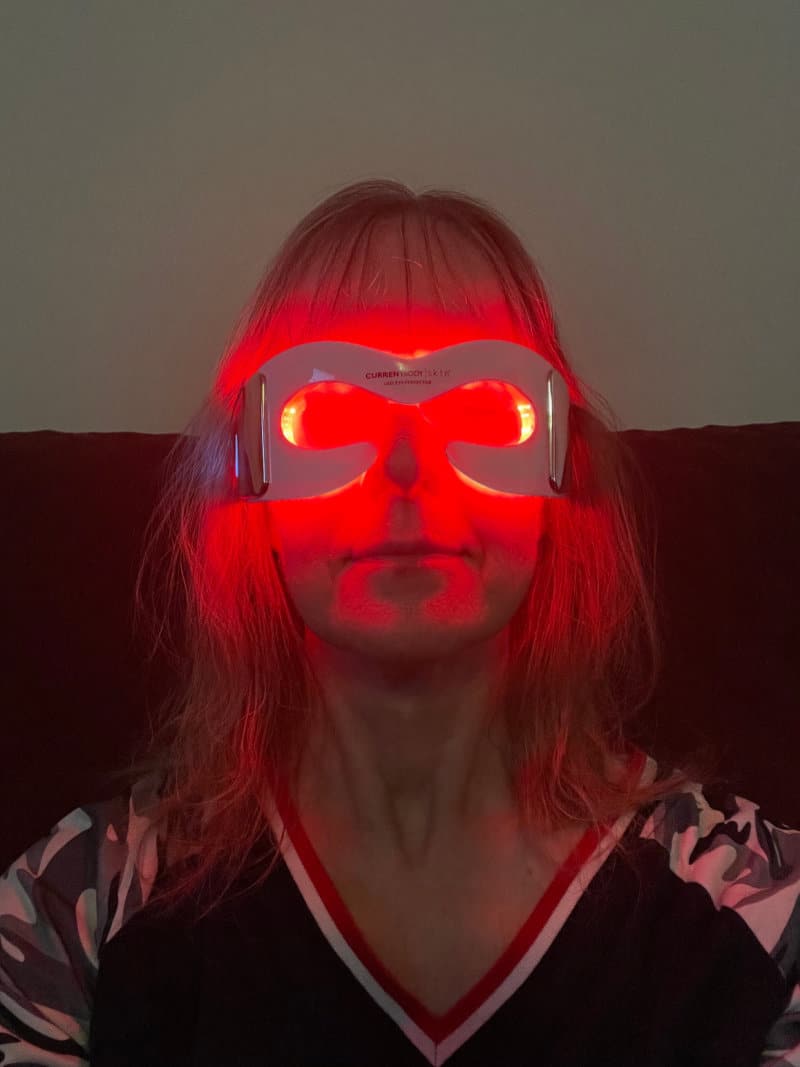 woman wearing a LED red light mask