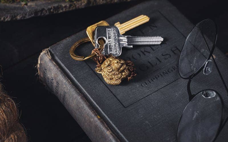gold keychain on a book