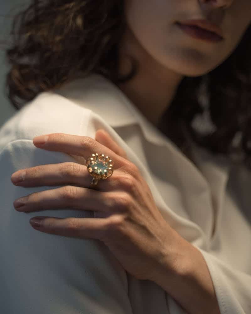 woman wearing a vintage brooch cocktail ring