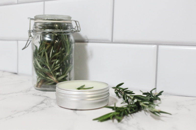 a jar of rosemary and a pot of salve