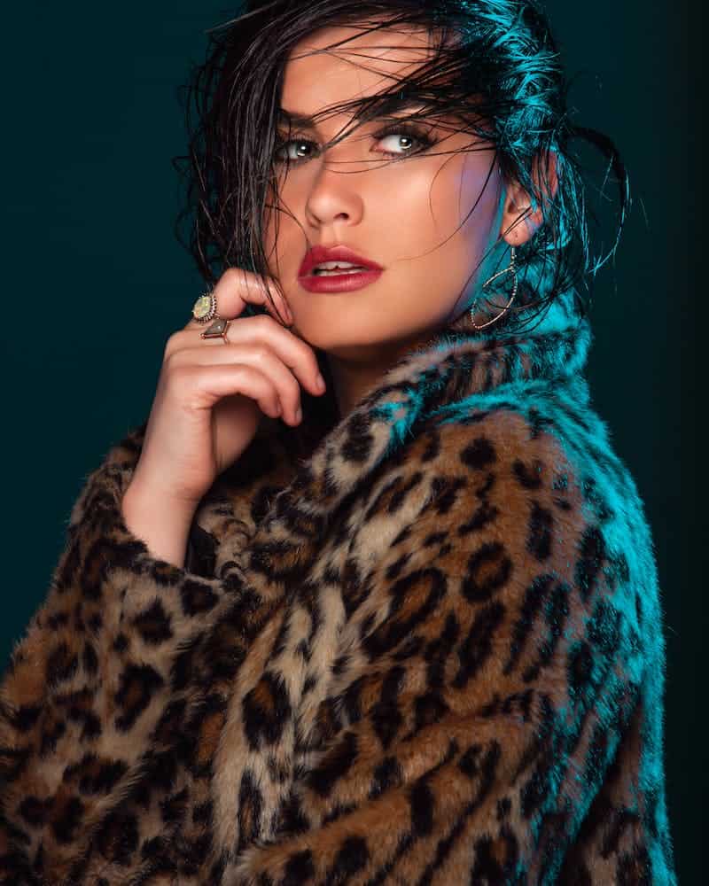 woman wearing a leopard skin coat