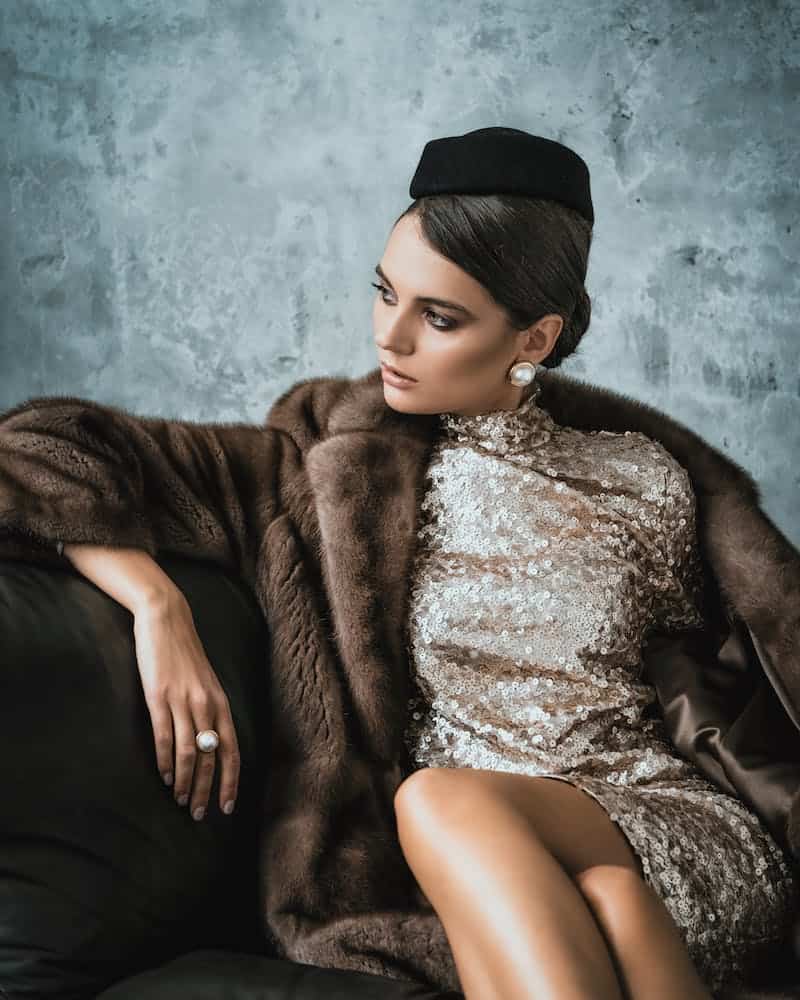a sophisticated woman wearing furs