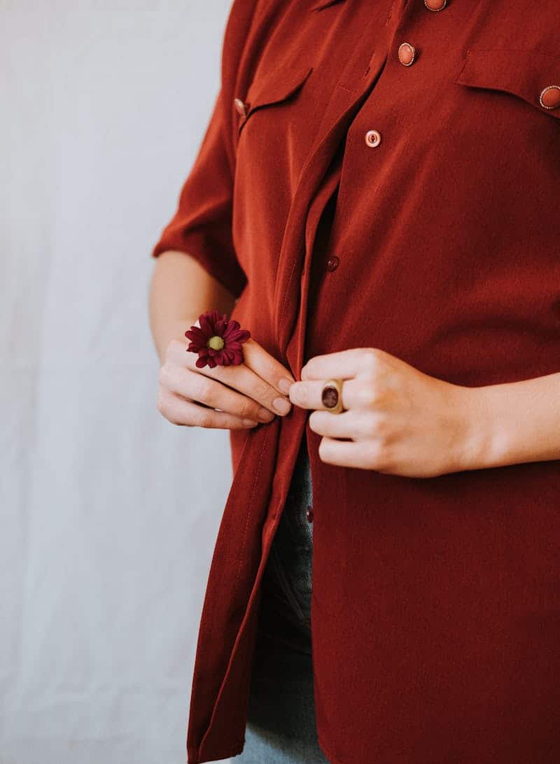 woman wearing a maroon button down shirt