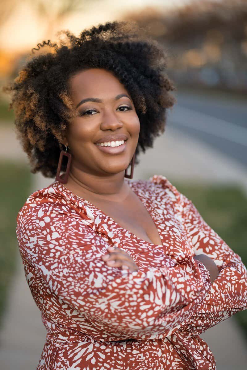 woman wearing a red peplum shirt