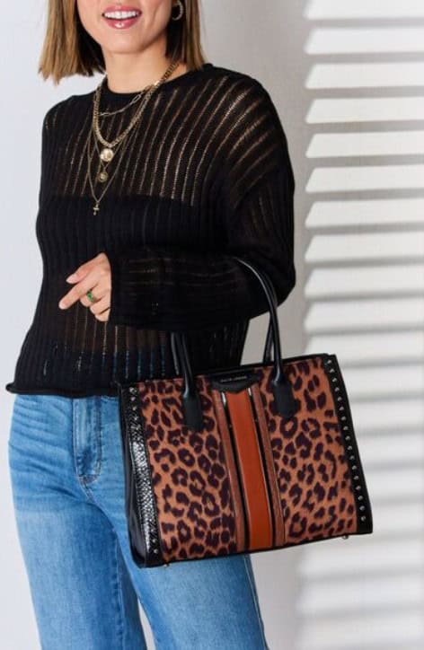 woman with a leopard handbag