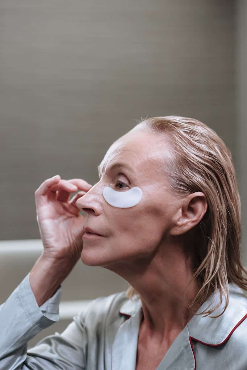 woman wearing eye patches for skin care