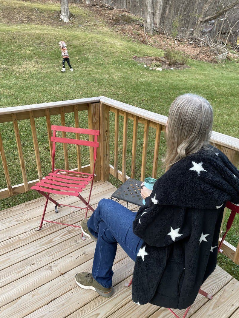 woman sitting in a chair outside