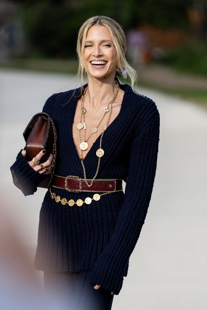 woman wearing a black belted dress