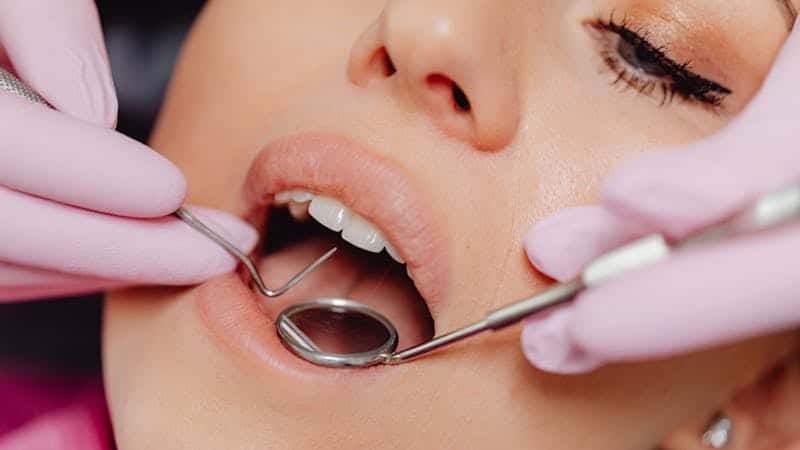 woman having dental exam for dental treatments
