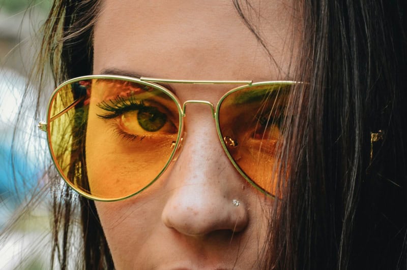 woman wearing gold frame glasses