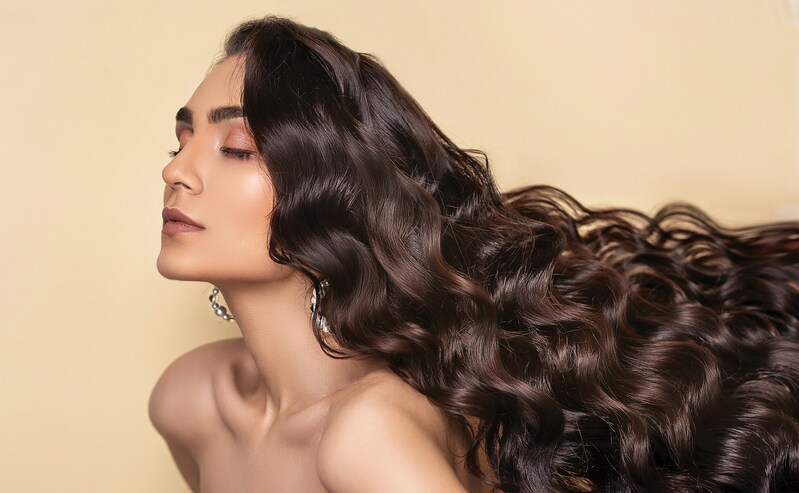 woman with eyes closed and healthy long hair