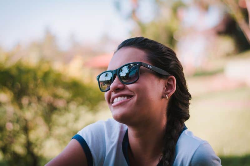 smiling woman wearing sunglasses